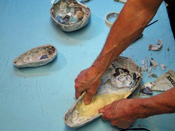 putting the paper mache shells together