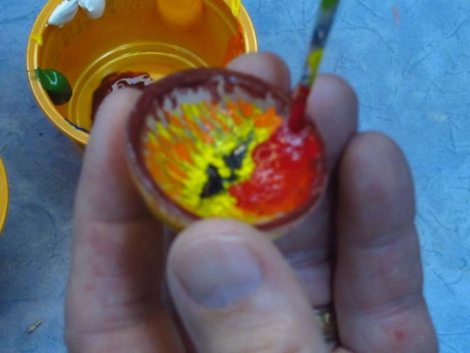 paper mache dragonfly- eyes with red paint