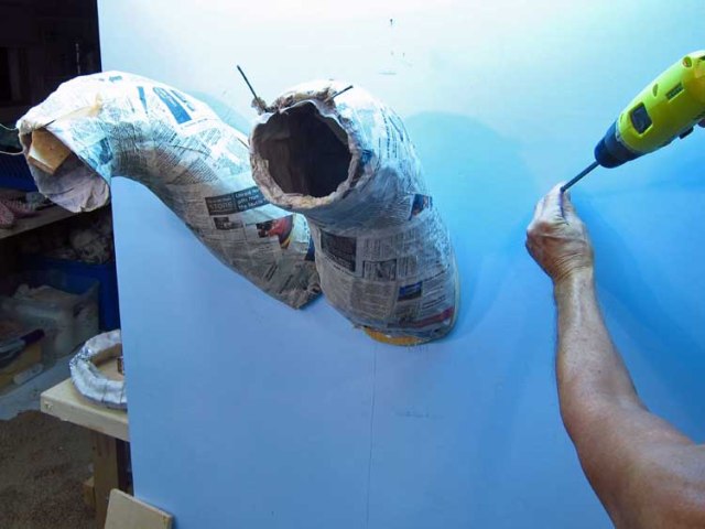 paper mache Tiamat - attach necks to wall